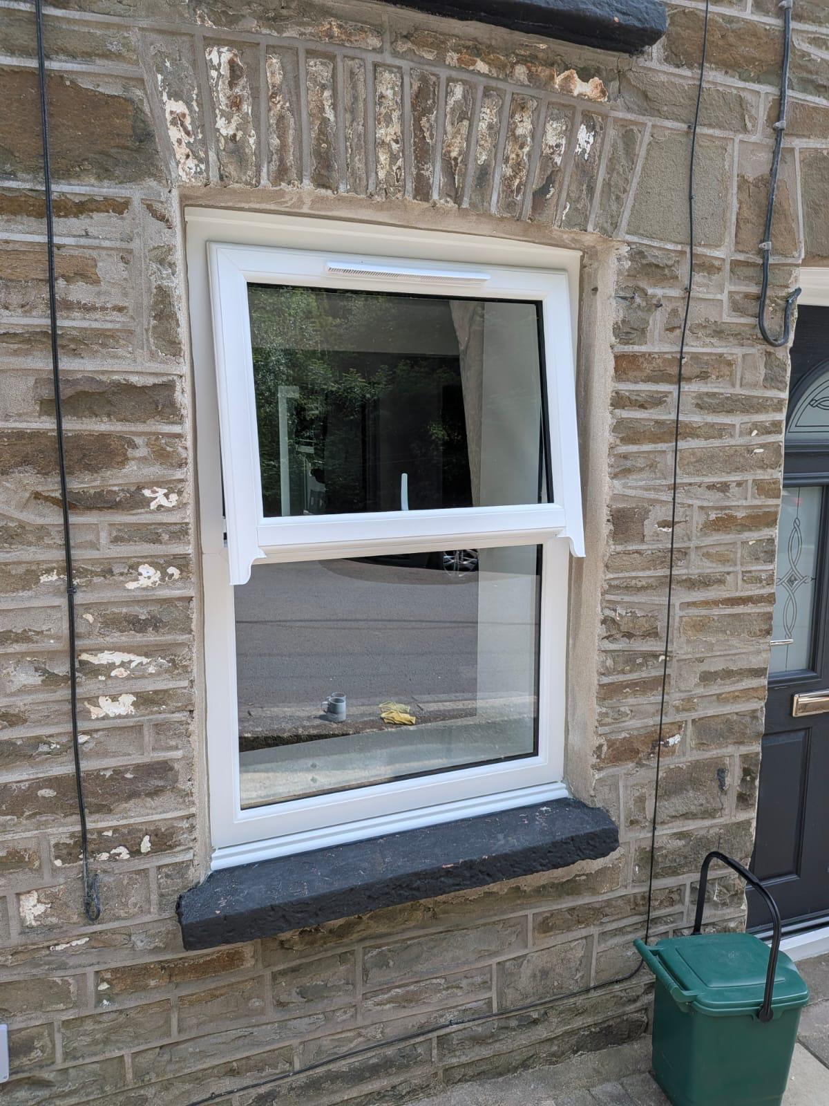 uPVC window installation showing multi-chambered frame profile