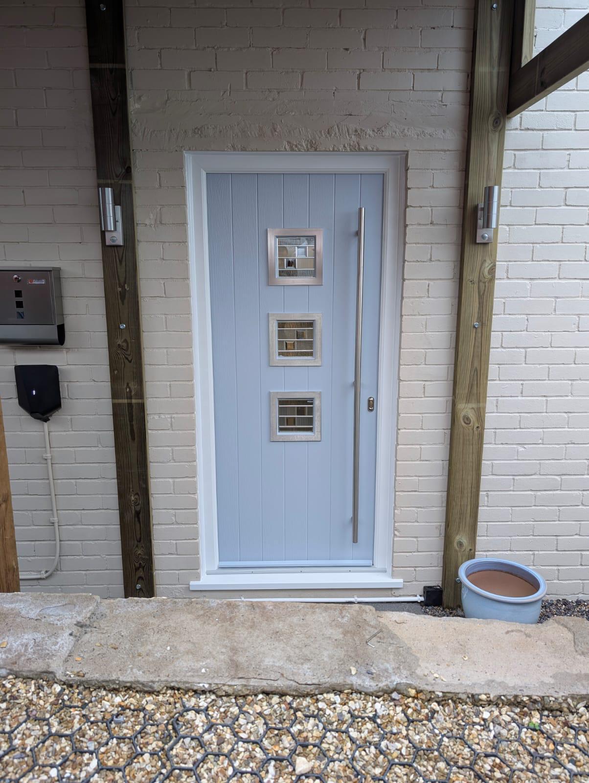 Grey composite back door with matching frame