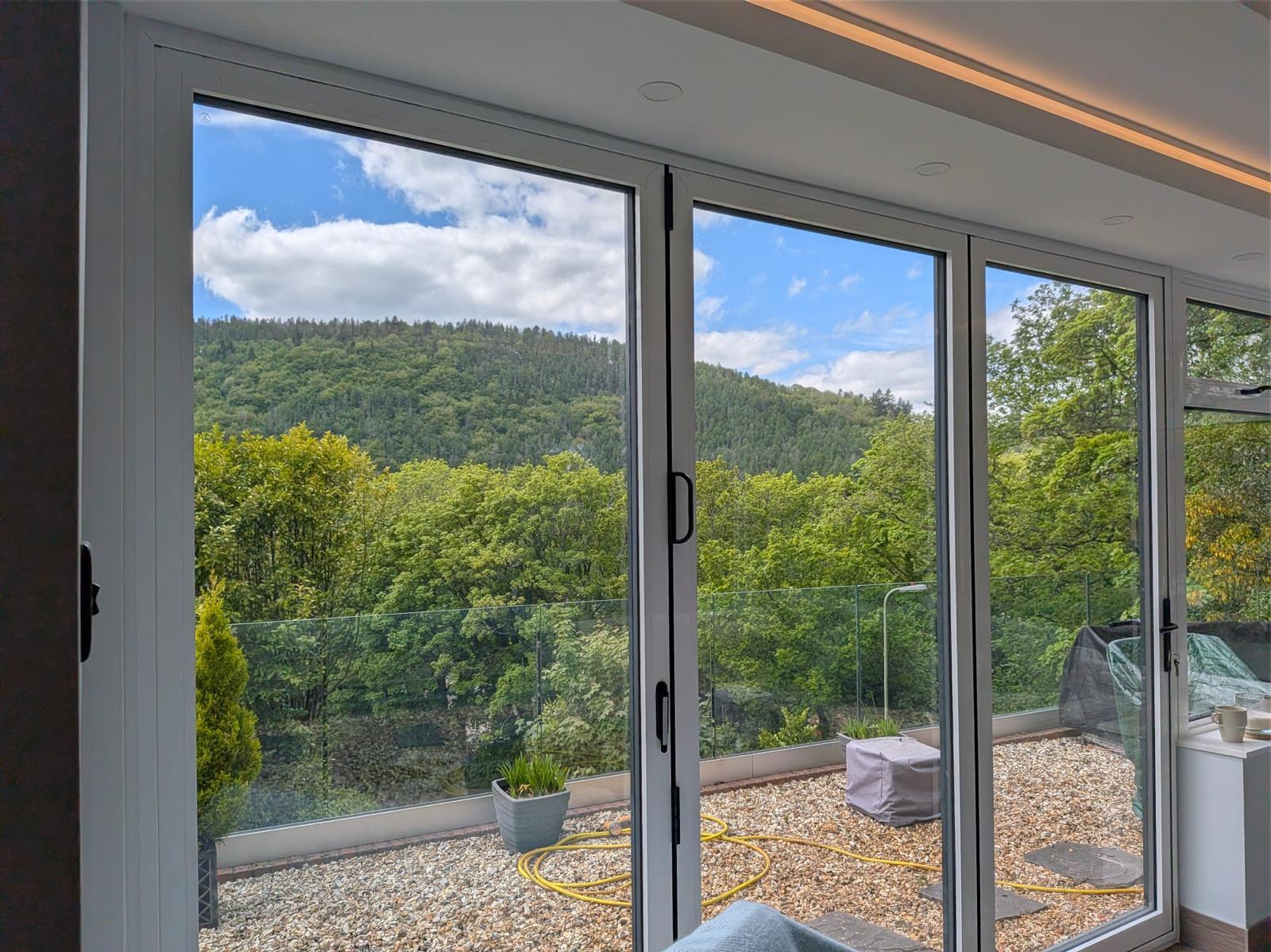 Aluminium Bi-folds installation by Essential Glazing Products